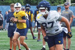 Someone has won WVU's quarterback job but Neal Brown won't say who